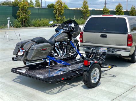 A great looking high "quality" fully road legal single wheel trailer or that will sit on the back of a sports tourer custom bike and will swallow all. . Three wheel motorcycle trailer